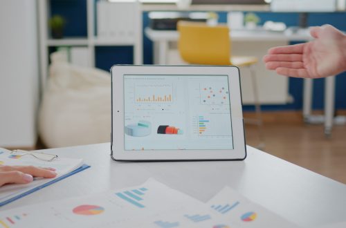 Close up of tablet and papers with data charts on desk used by workmates for business development. Corporate colleagues working on project presentation for management and marketing strategy SSUCv3H4sIAAAAAAAAA01Rwa7bIBD8F85GBQwG5/gOvVXq/amHBdYJesREBvfpKfK/d504bTmxO8PsMnNnKbIT01rEYRosN8YHrpUO3BvtuDRGBOvQDL1jHYvQkJ1kr5wetFVKSTMIOh3zUFNgpztLOa+1LdBSmdmJkAXniMvjijG1siTIVG0dqw3aWrHSM6oCaZ8JfdQvvff73qcF39aaZqz12/c0wxyQlqmrJ+AnlltGtnUv5tF44T9SDZgzzFjW+h/tL4FtvzoGZ5zD177Itm+cER57vTM1gcMxRO4n9FxHN3JQOFDplJOTASkDSQ0i9La3Ezd6dFxbZ7jToLh0YvTopgBSEM0aPw7CaK56QzQpBaeG5DZaK8KAQWsgmnbGIgrFp9FErk3wfJzAc6ut9MSMYtyHjjqAlUhR9WNPalPkYEnNSaWlhkFa7Bl97uOz4XI9bC7tsqdBNpR1bsvX04pcyg082XaaIFfs2AVqJUI8GvTwtqSQ5vMRFmVcrs/7XNru1cPRVsJHiseoZ76XRN19zp2tt1wgYjzg1V9Ta69ywd8JP/+xt237AxDRzFKdAgAA